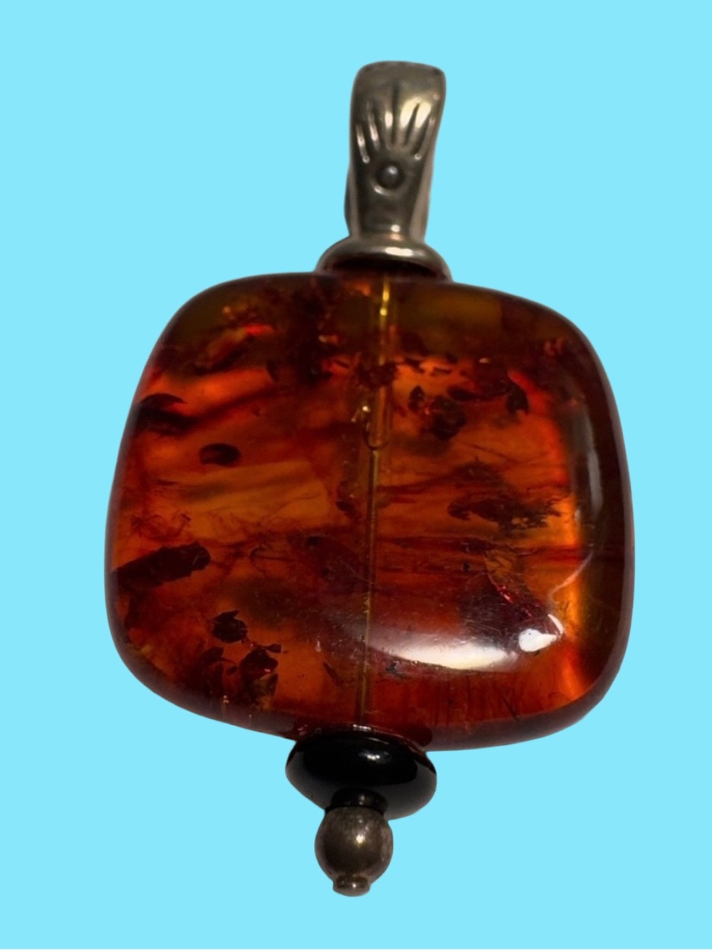 Square-shaped Amber gemstone pendant set in 925 sterling silver.